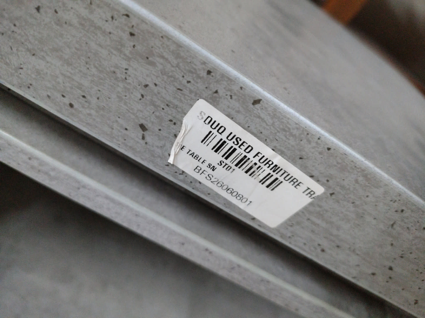 Bufaisal barcode label BFS26060801 for used grey side table at Shop C Ajman