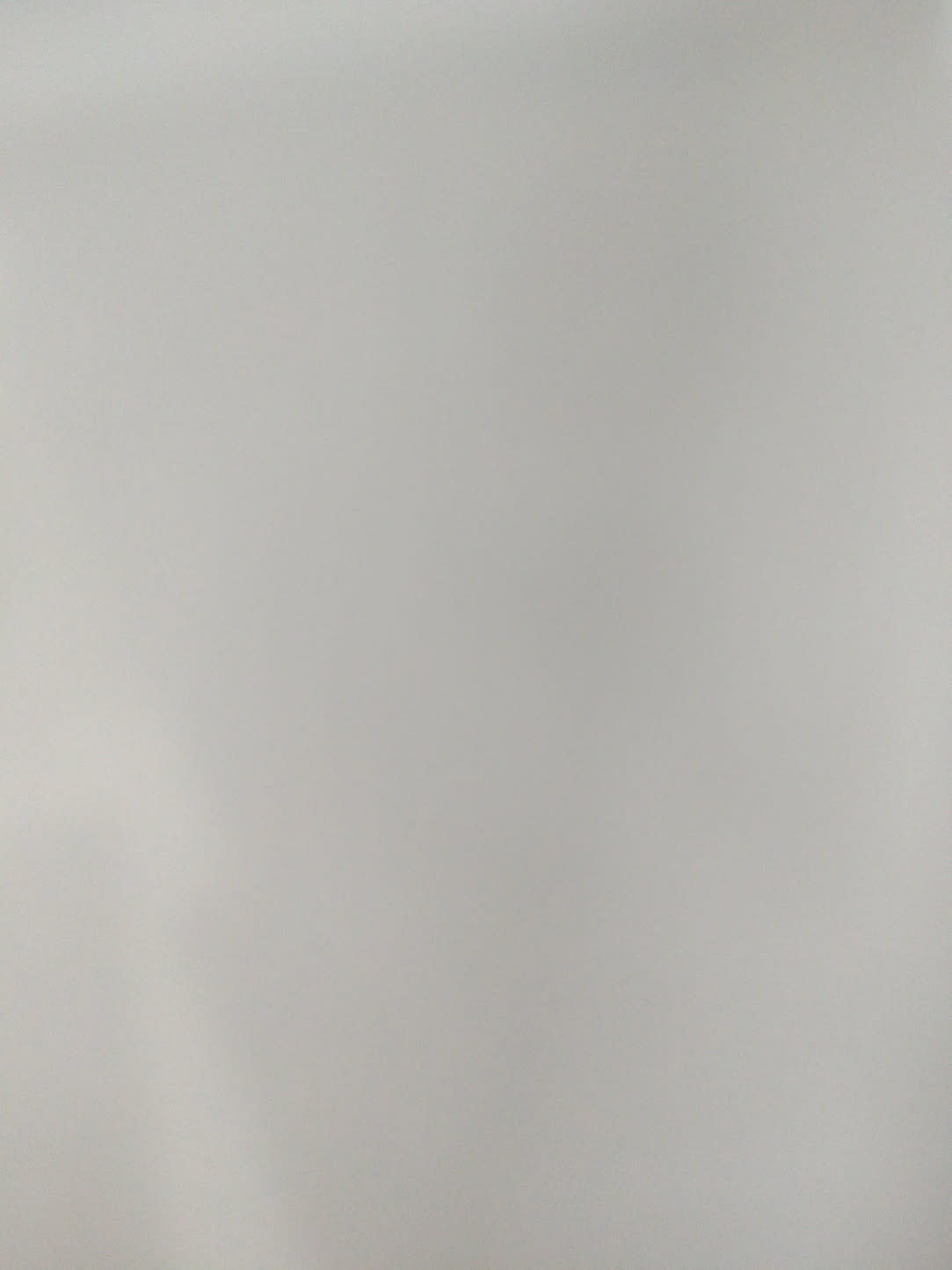 Barcode label photo for used white round nightstand at Bufaisal Shop C Ajman — label unreadable
