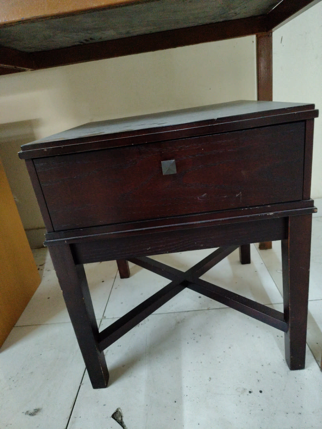 Bufaisal barcode label for used dark wood single-drawer nightstand at Shop C Ajman