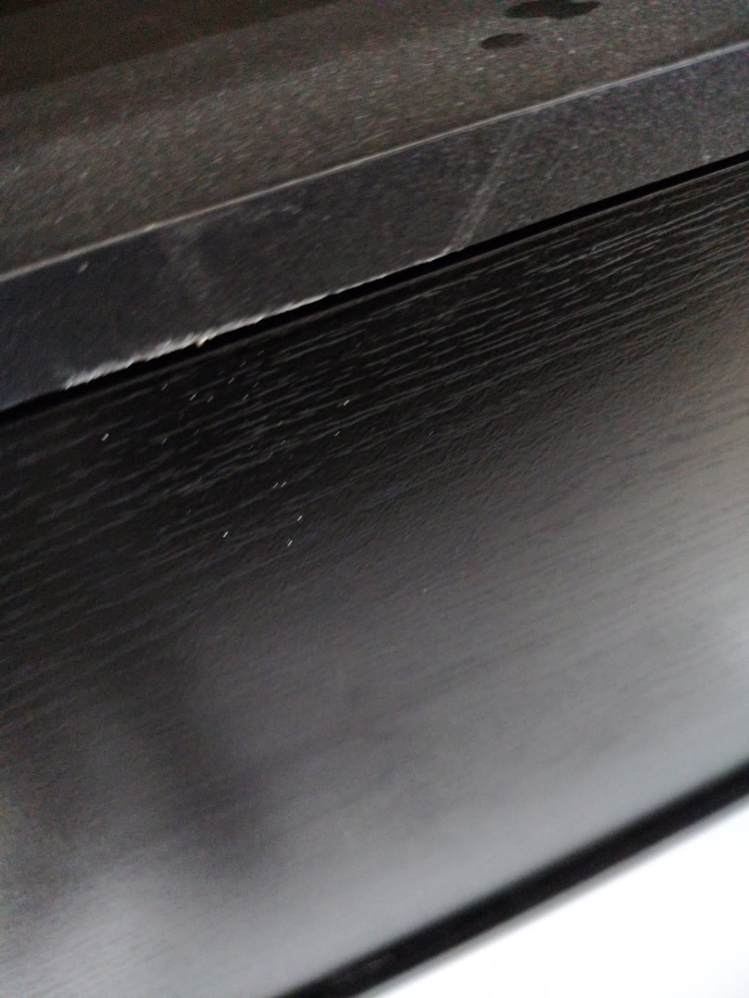 Barcode label photo unreadable — used black TV stand at Bufaisal Ajman