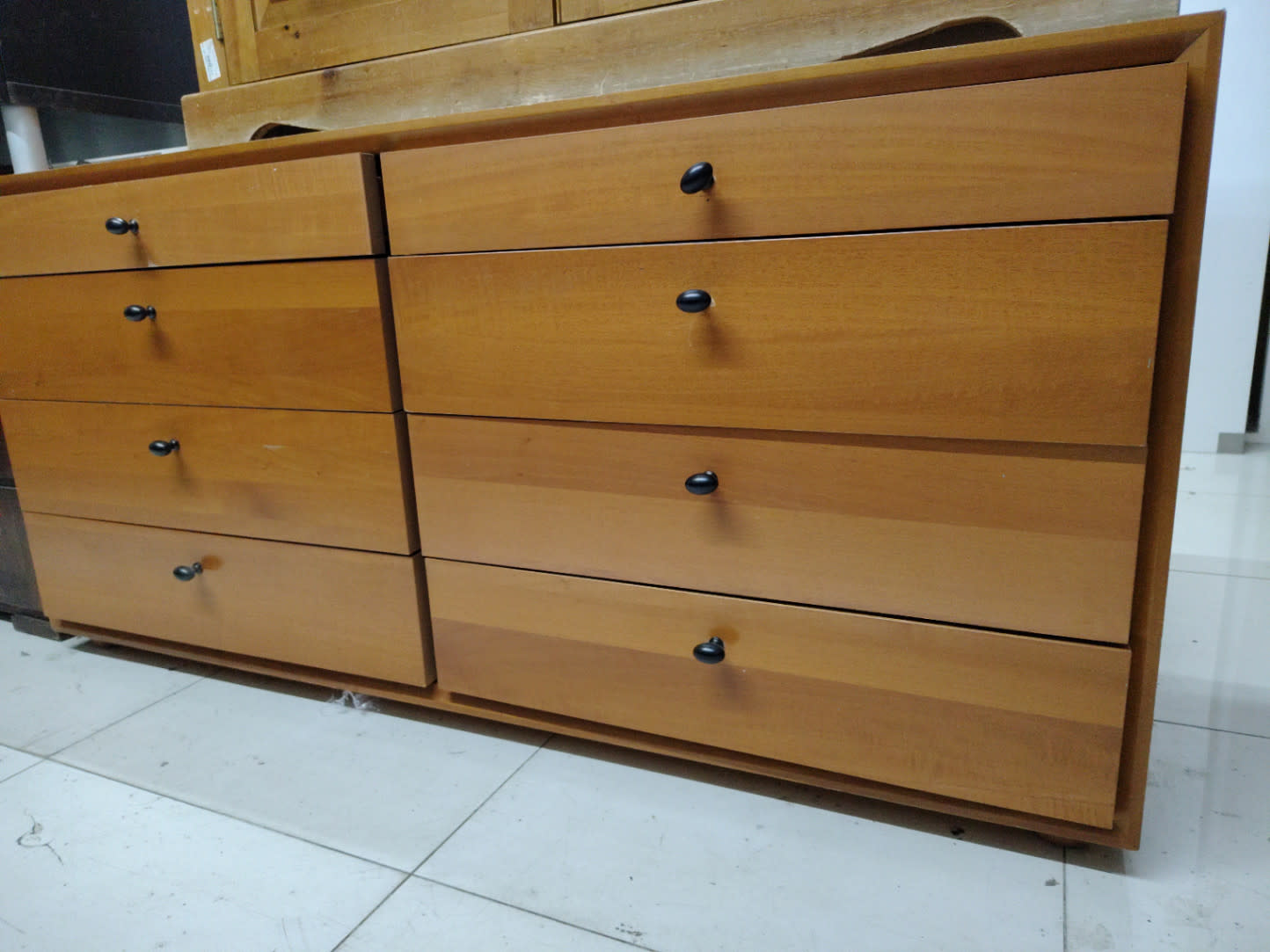 Close-up front view of used 8-drawer double dresser light oak at Bufaisal Shop C Ajman