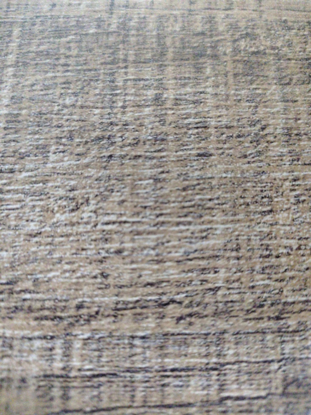 Close-up of walnut brown wood-grain laminate surface on used TV stand at Bufaisal