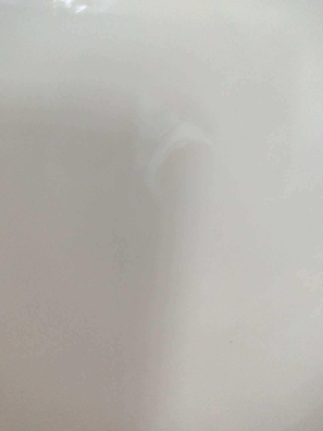 Barcode label photo for used white TV stand at Bufaisal Ajman — label unreadable