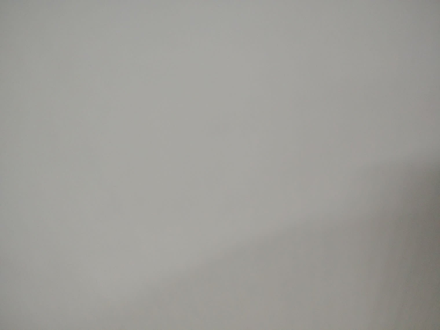 Barcode label photo for used white TV stand at Bufaisal Ajman — label unreadable