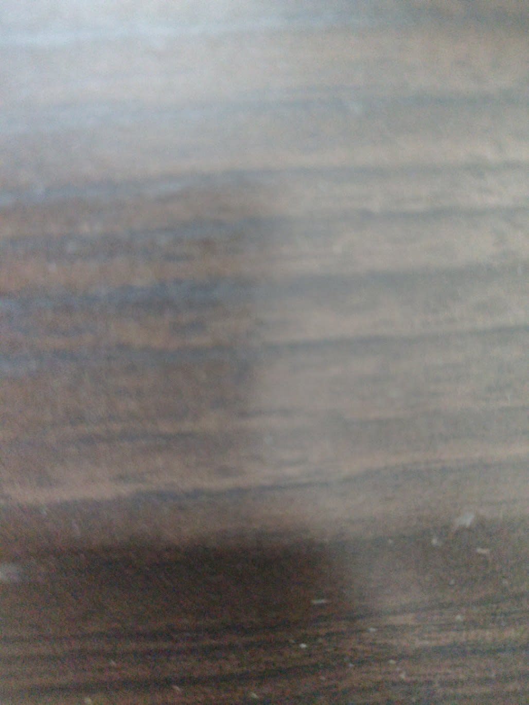 Barcode label photo for used dark brown TV stand at Bufaisal — label unreadable