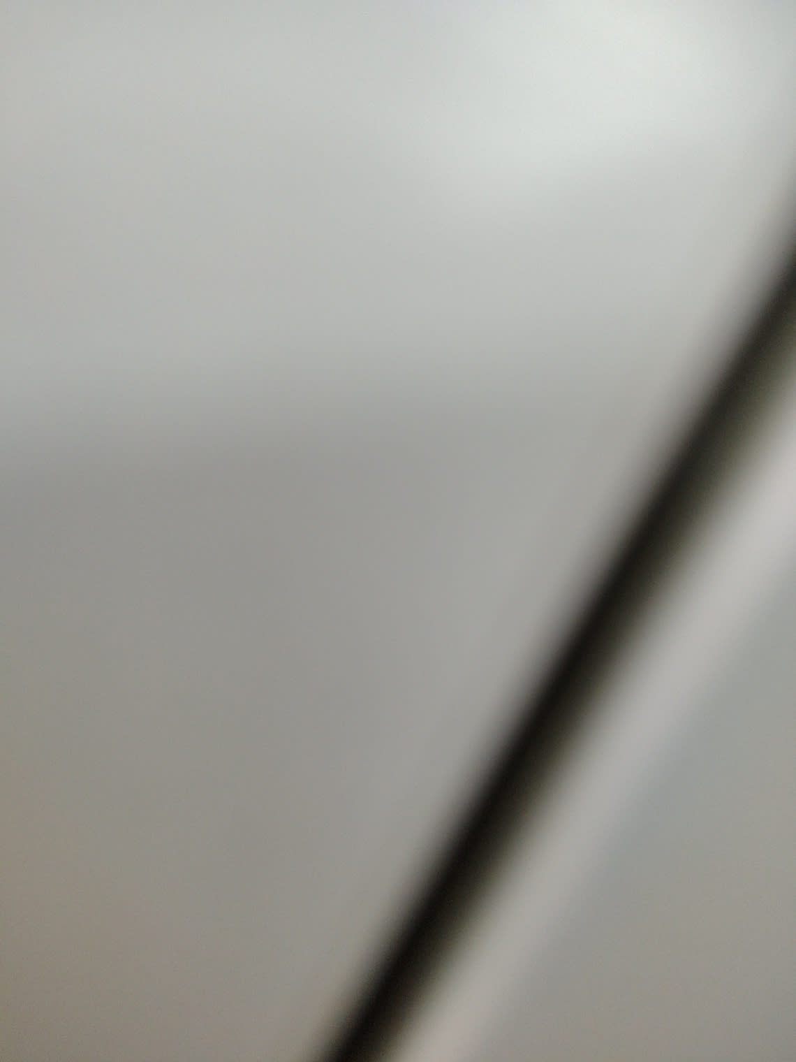 Barcode label photo for used white 3-drawer dresser at Bufaisal Ajman — label unreadable