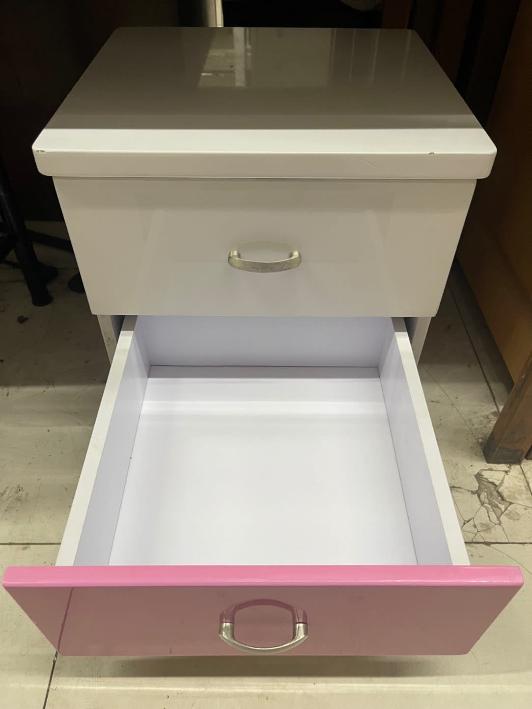 Bottom pink drawer open on used bedside nightstand showing clean interior, Bufaisal Shop C Ajman