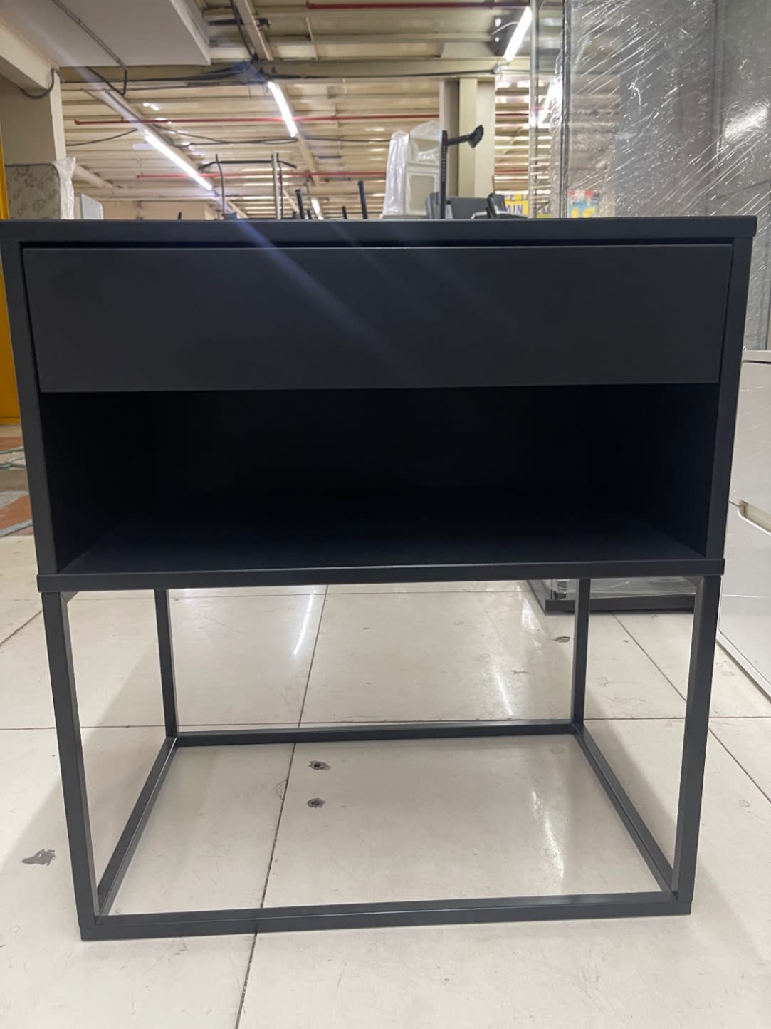 Bufaisal barcode label for used black nightstand at Shop C Ajman