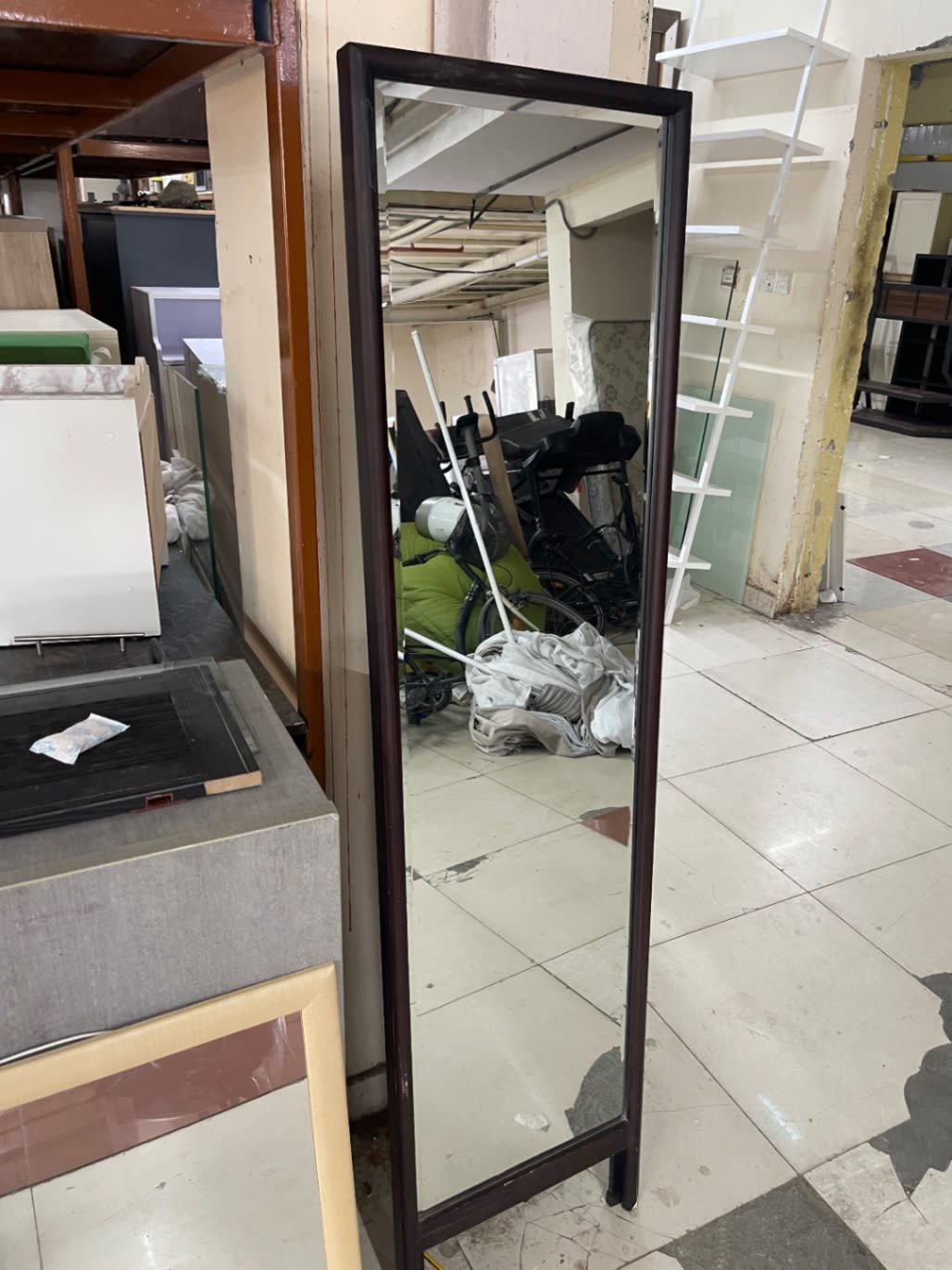 Used full-length floor standing mirror dark brown frame available at Bufaisal Shop C Ajman