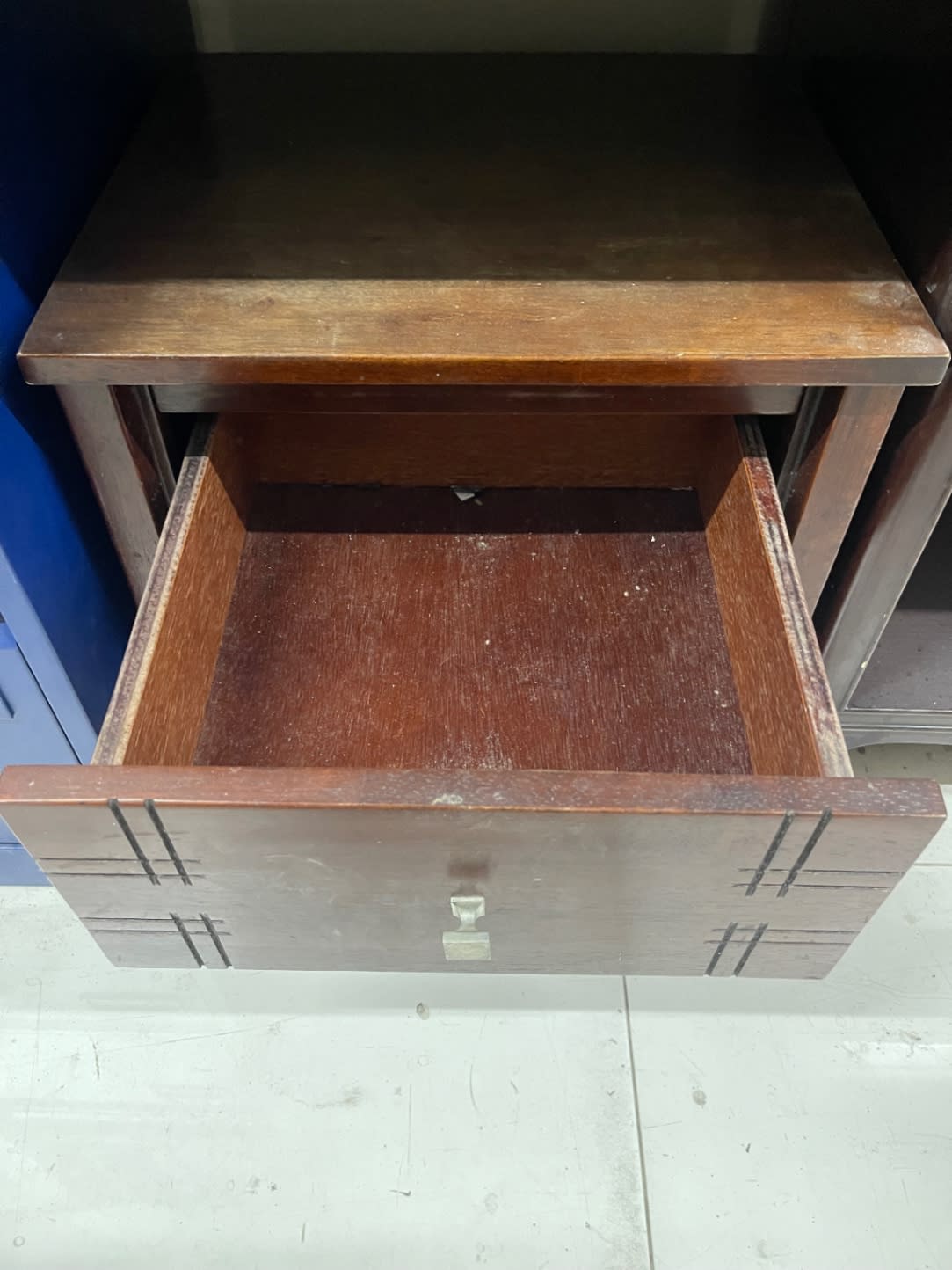 Bufaisal barcode label for used 2-drawer wooden nightstand at Shop C Ajman