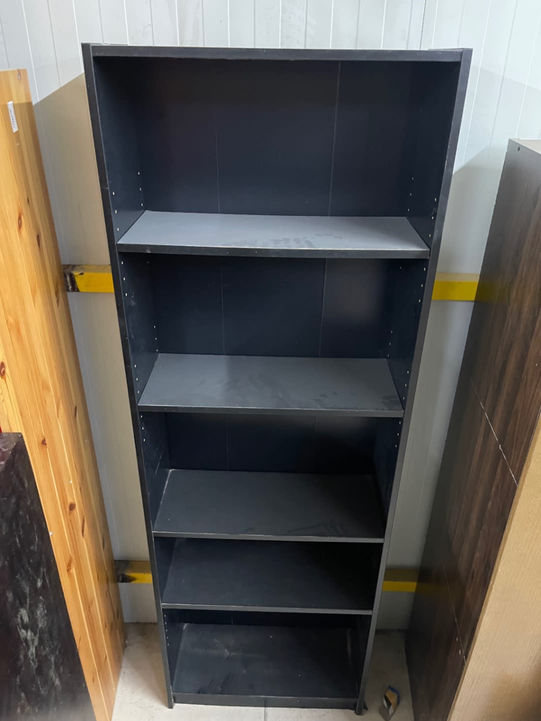Bufaisal barcode label for used dark grey 5-shelf bookcase at Shop C Ajman