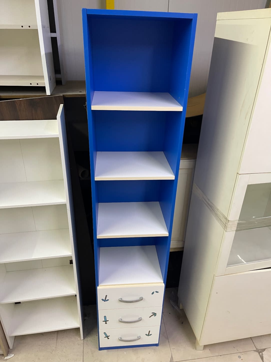 Fourth view of used blue and white kids bookcase with drawers at Bufaisal Ajman