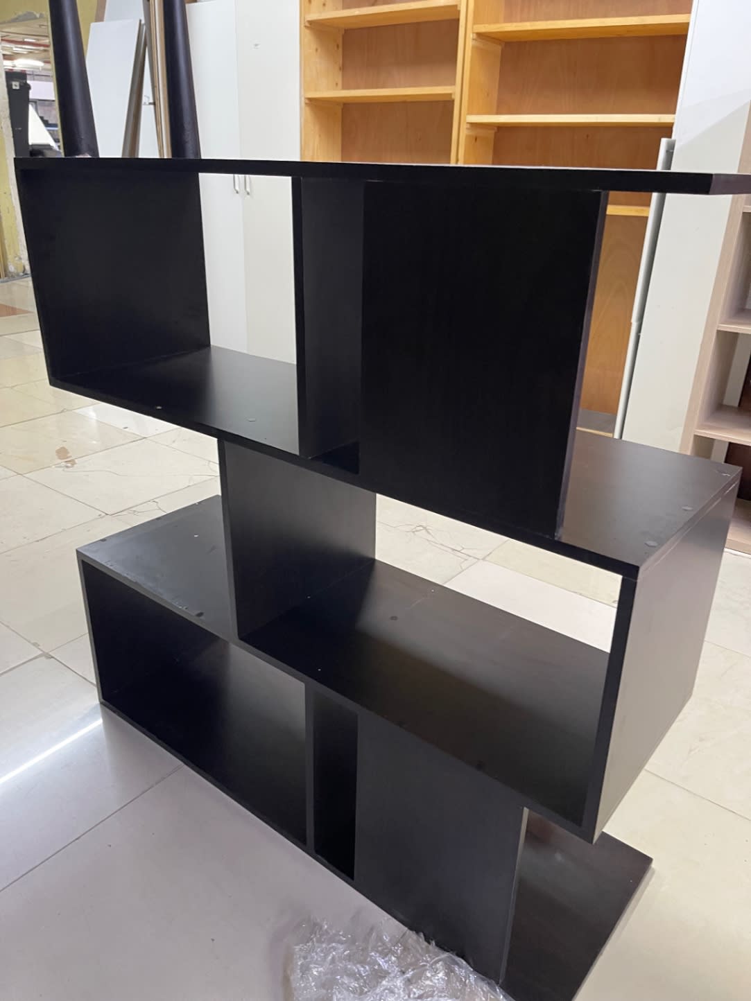 Fourth angle of used dark brown step bookshelf unit showing overall structure at Bufaisal Ajman