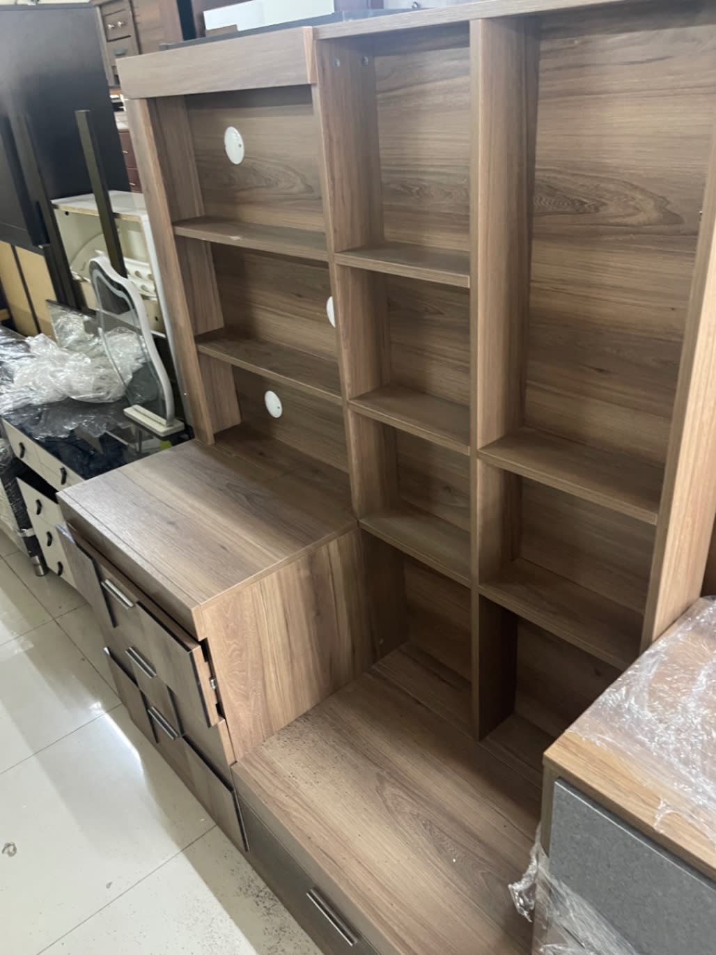 Additional angle of used walnut TV unit with open shelves and drawers at Shop C Bufaisal Ajman