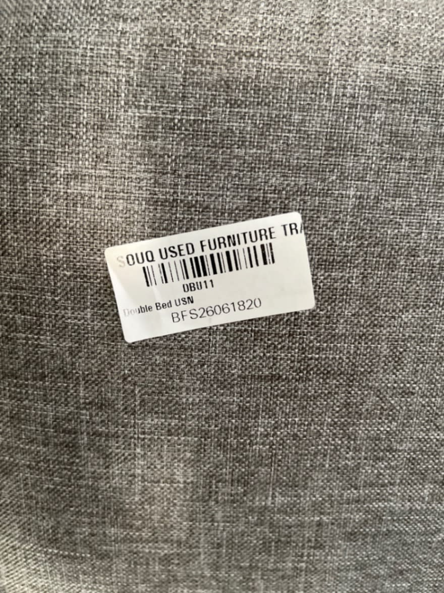 Bufaisal barcode label BFS26061820 for used double bed frame at Shop C Ajman