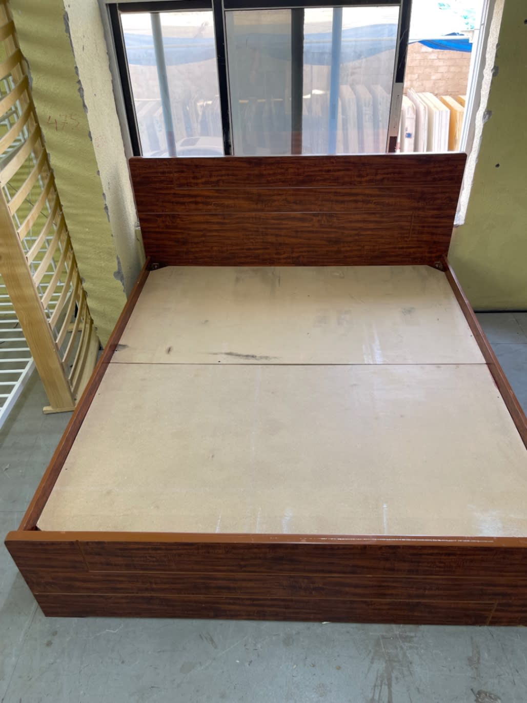 Bufaisal barcode label for used king bed frame at Shop C Ajman