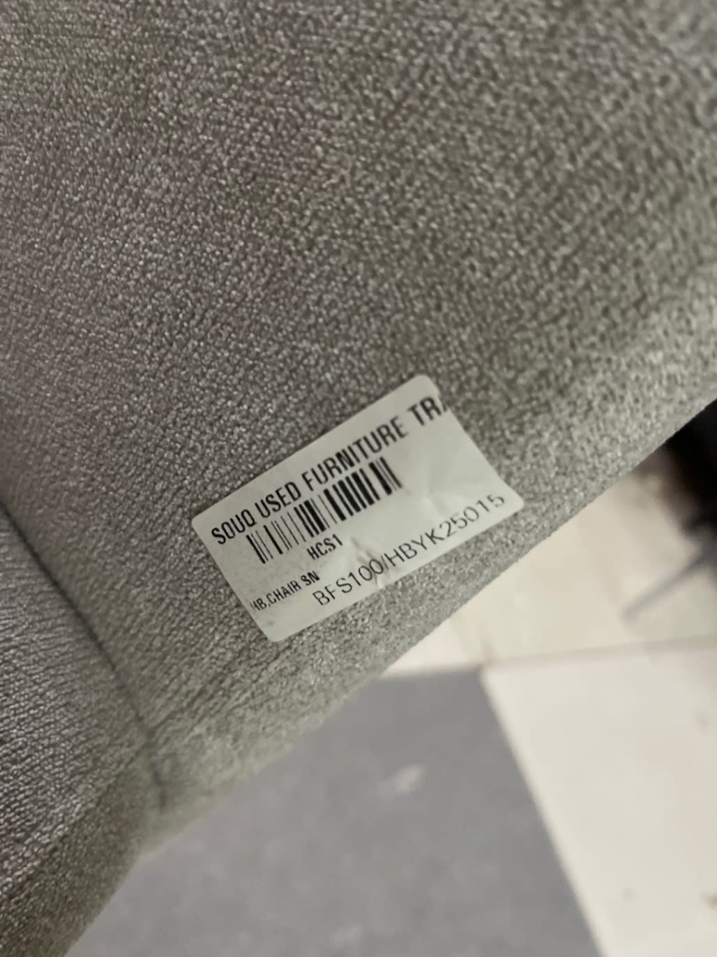 Bufaisal barcode label BFS100HBYK25015 on new grey fabric dining chair