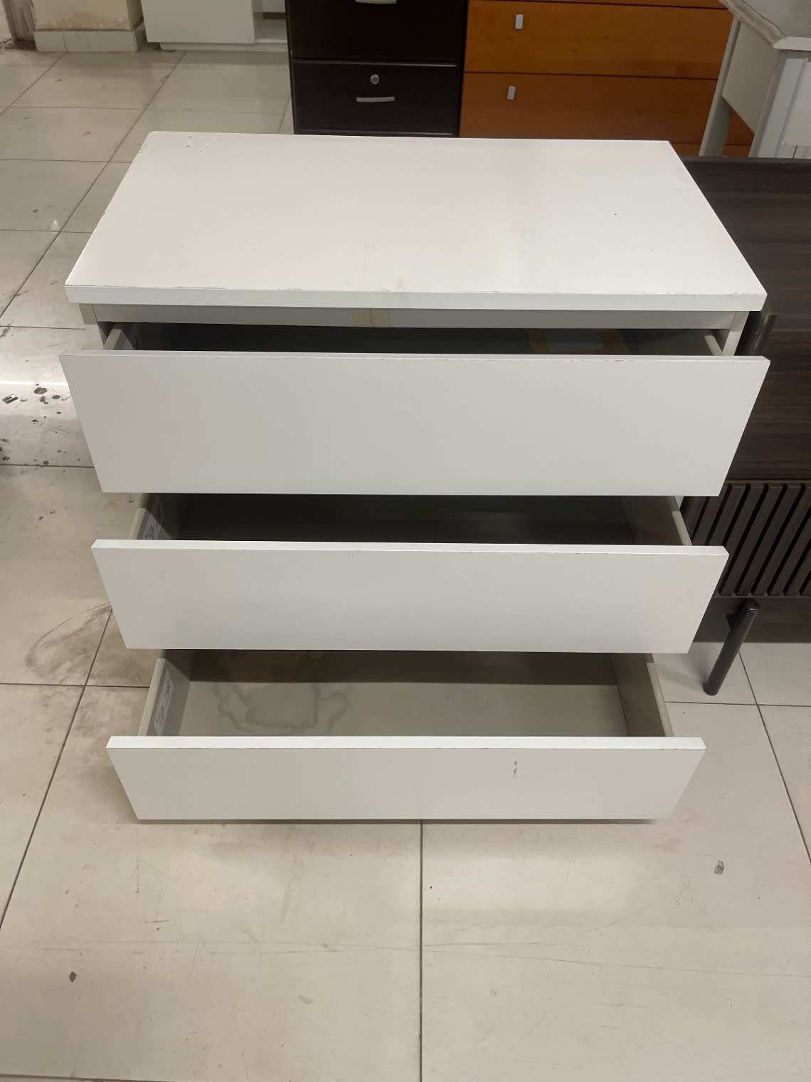 Used white 3-drawer dresser with all drawers open showing drawer interiors at Bufaisal Ajman
