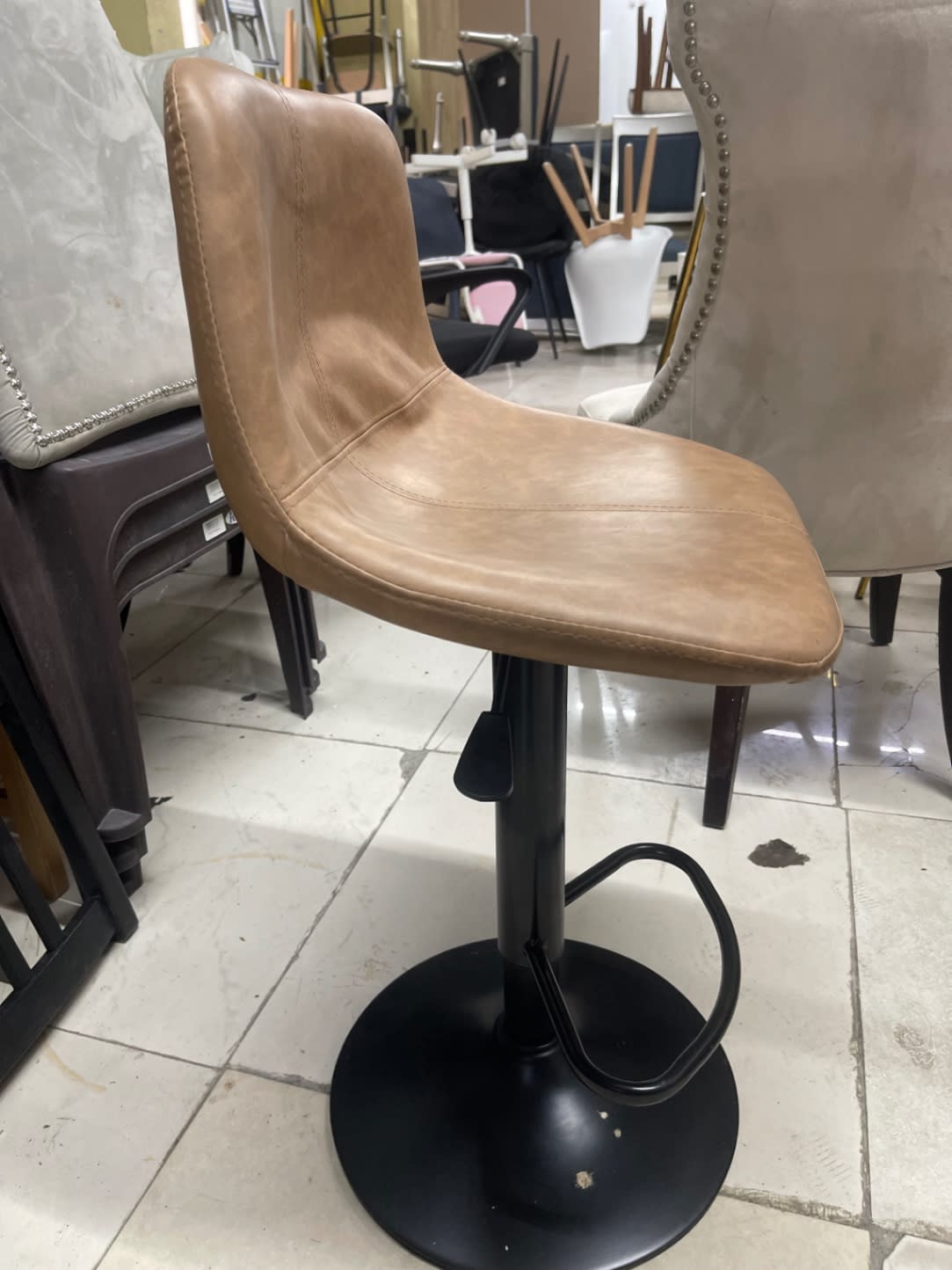 Side angle of used adjustable bar stool at Bufaisal Shop C Ajman showing overall condition