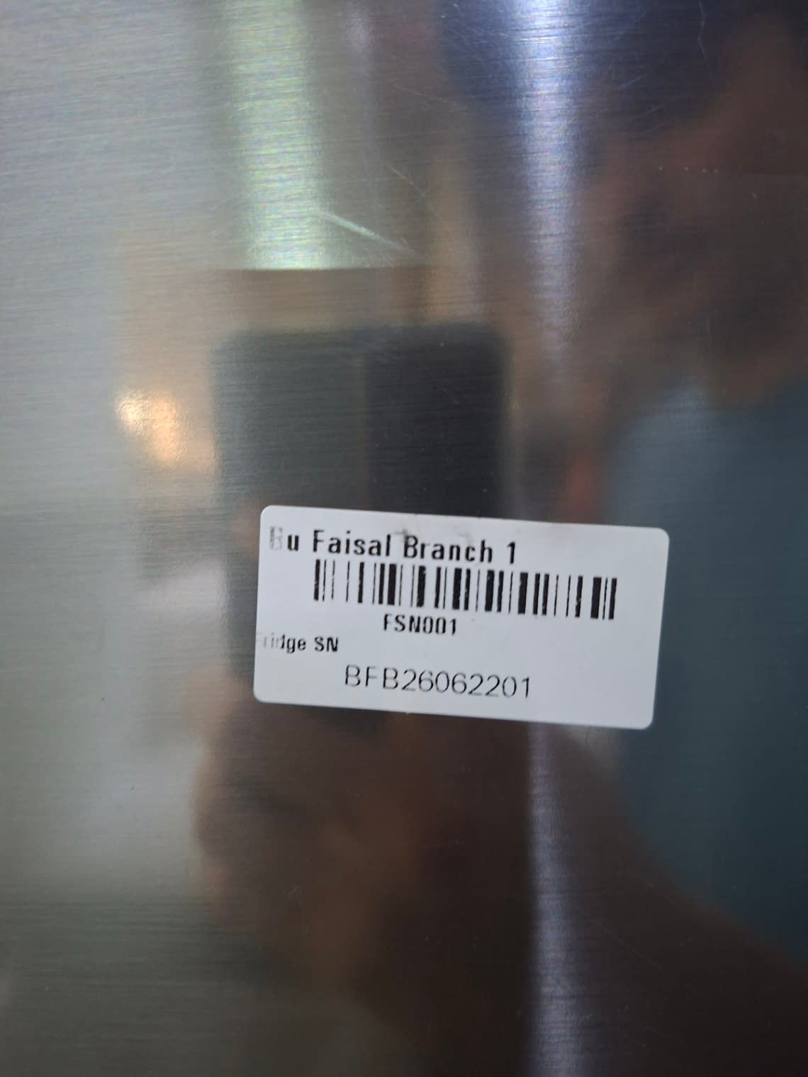 Bufaisal barcode label BFB26062201 for used LG top-mount refrigerator at Shop B Ajman