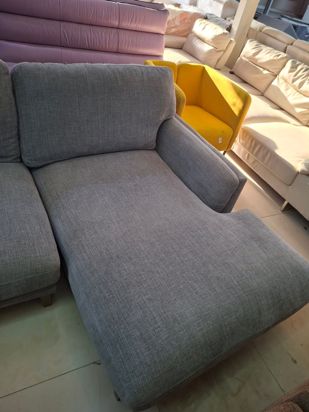 Chaise section detail of used grey L-shape sectional sofa at Bufaisal Shop B Ajman