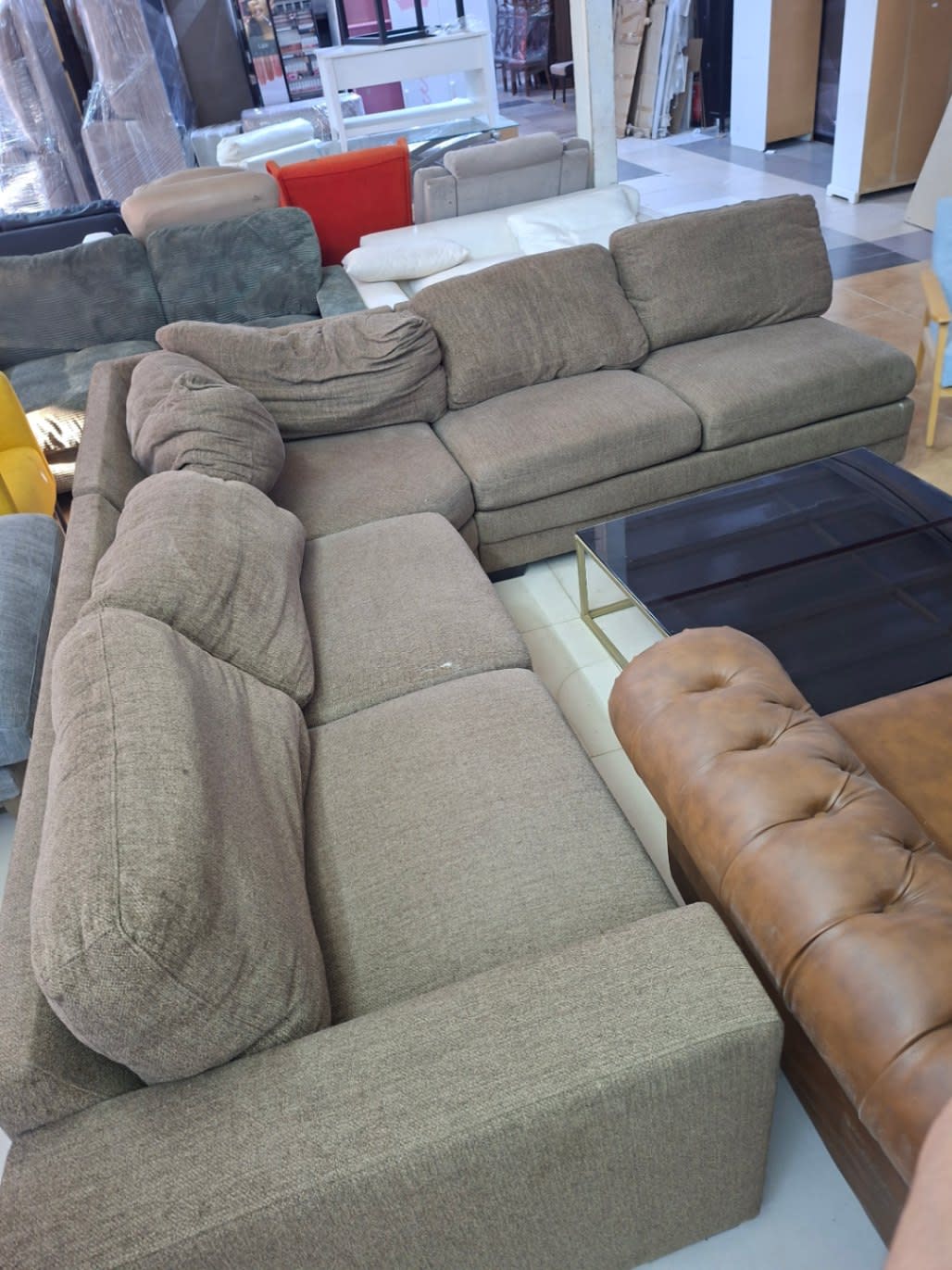 Bufaisal barcode label for used L-shape sectional sofa taupe fabric at Shop B Ajman