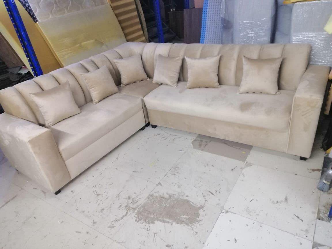 New beige velvet L-shape sectional sofa with cushions, available at Shop C Bufaisal Ajman