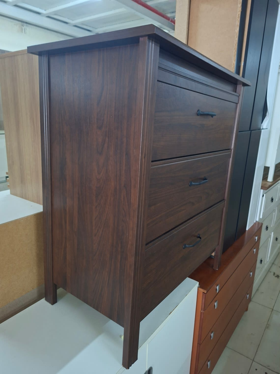Side profile of used 3-drawer chest of drawers dark walnut finish at Bufaisal Ajman