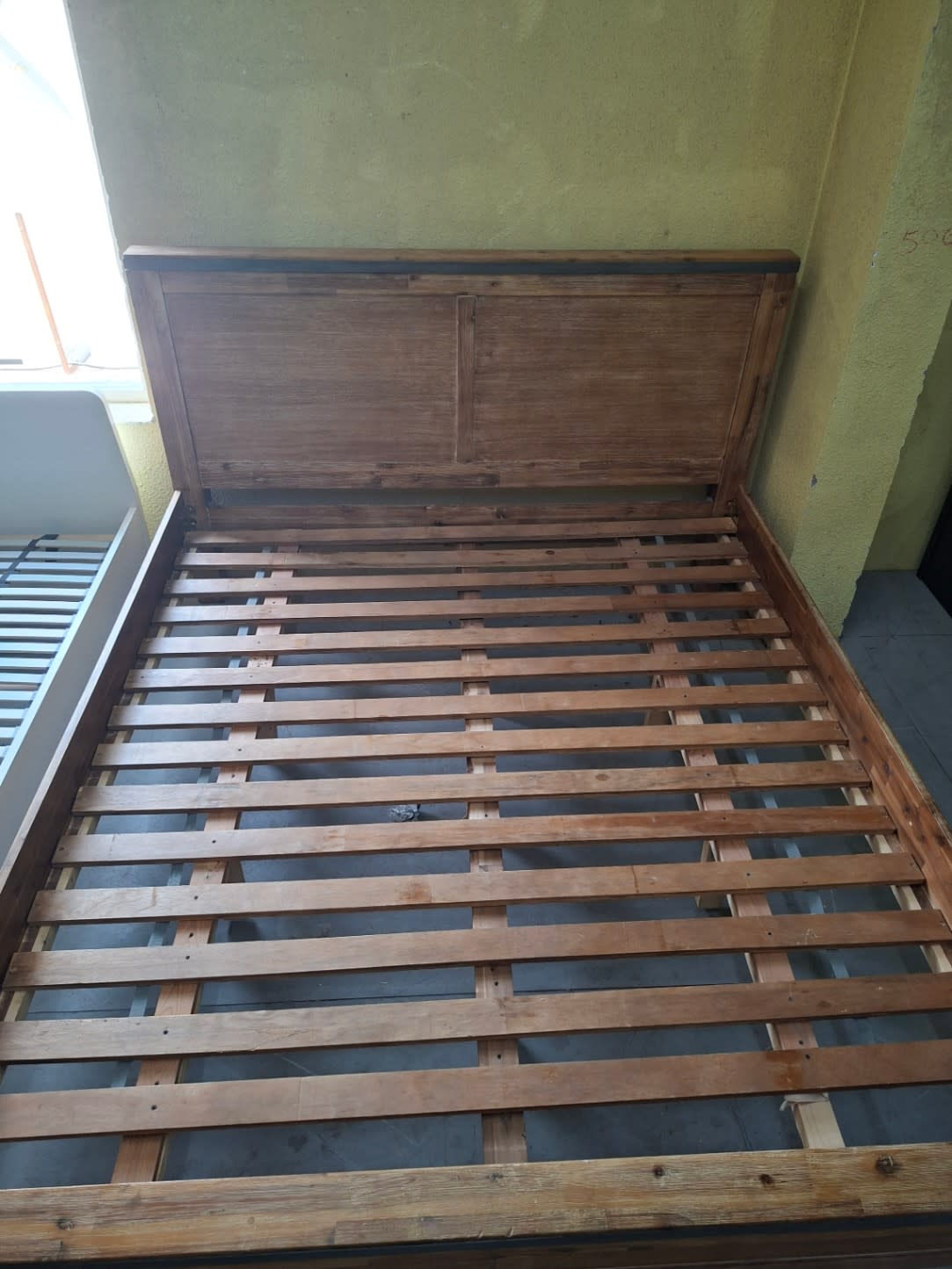 Bufaisal barcode label for used king bed frame at Shop C Ajman