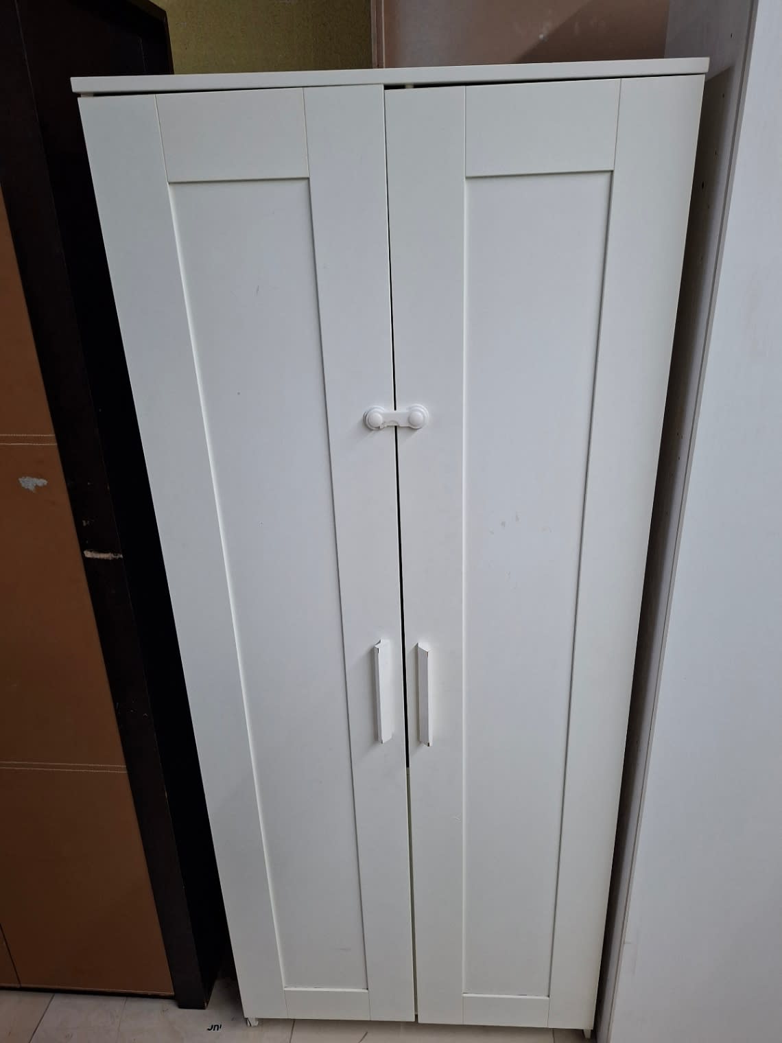 Second front view of used 2-door white wardrobe showing overall condition at Bufaisal Ajman