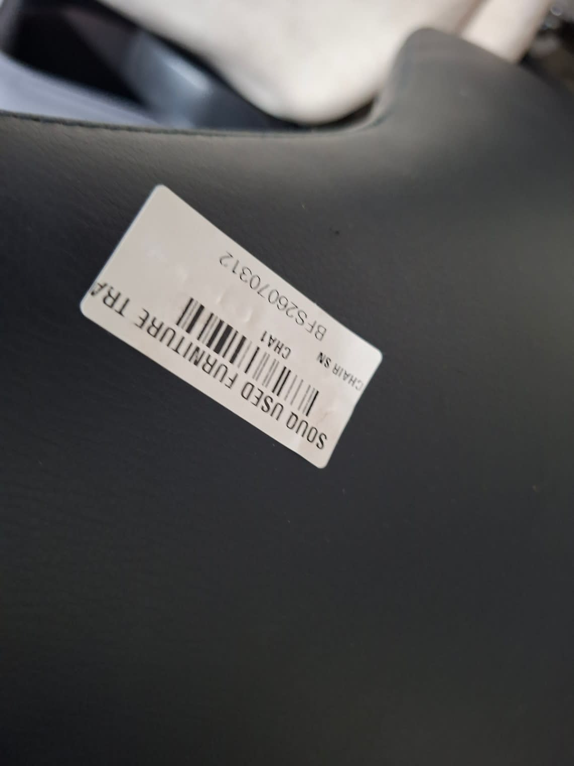 Bufaisal barcode label BFS26070312 for used black dining chair at Shop C Ajman