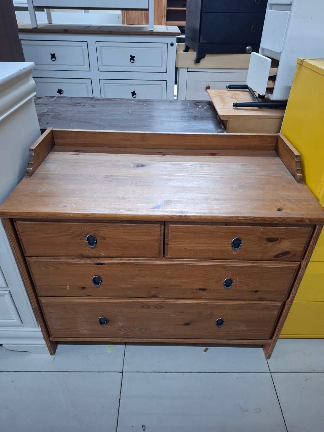 Used pine 4-drawer chest of drawers angle view showing surface condition at Bufaisal Shop C Ajman