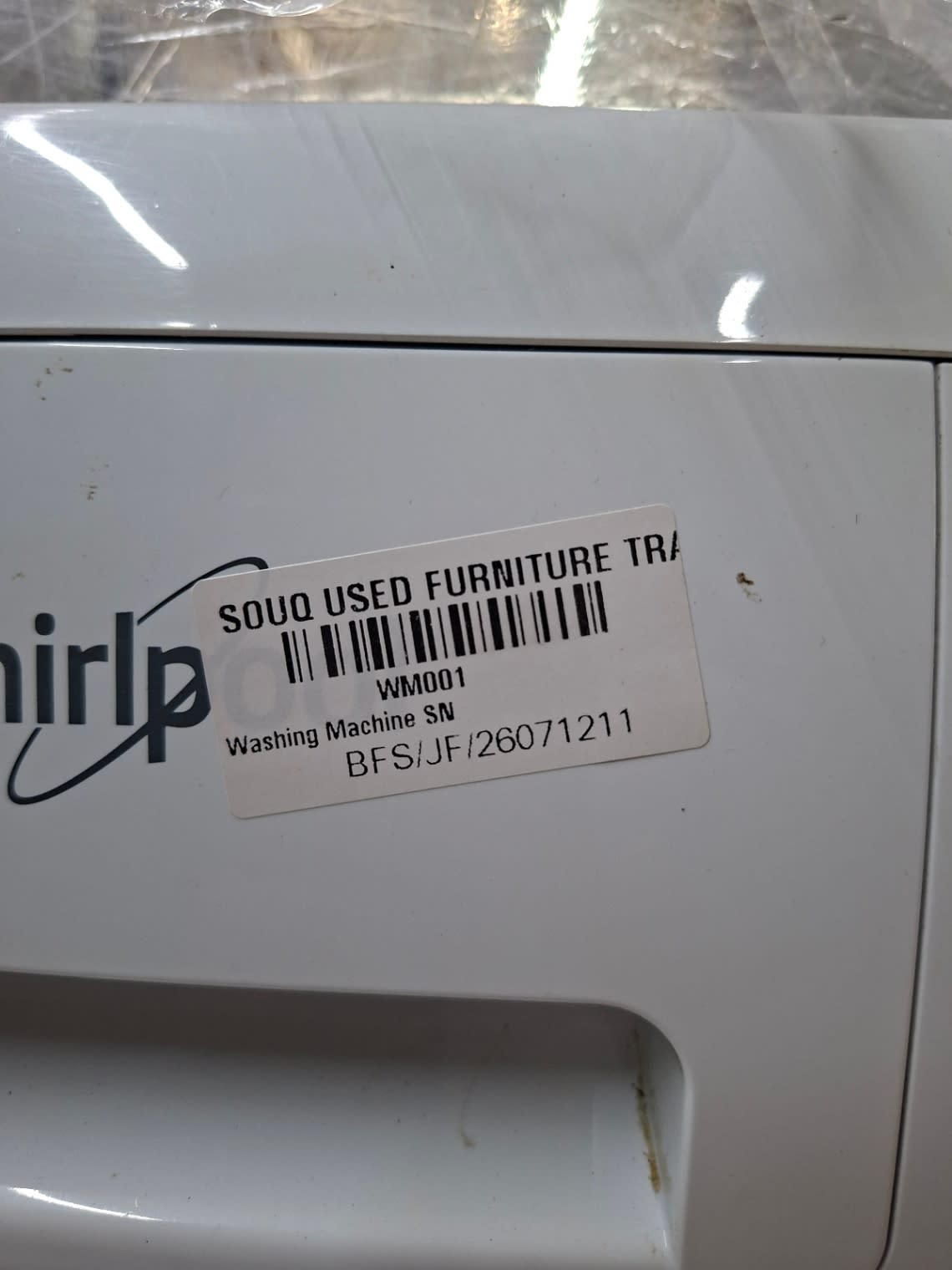 Bufaisal barcode label BFS/JF/26071211 on used Whirlpool front-load washing machine