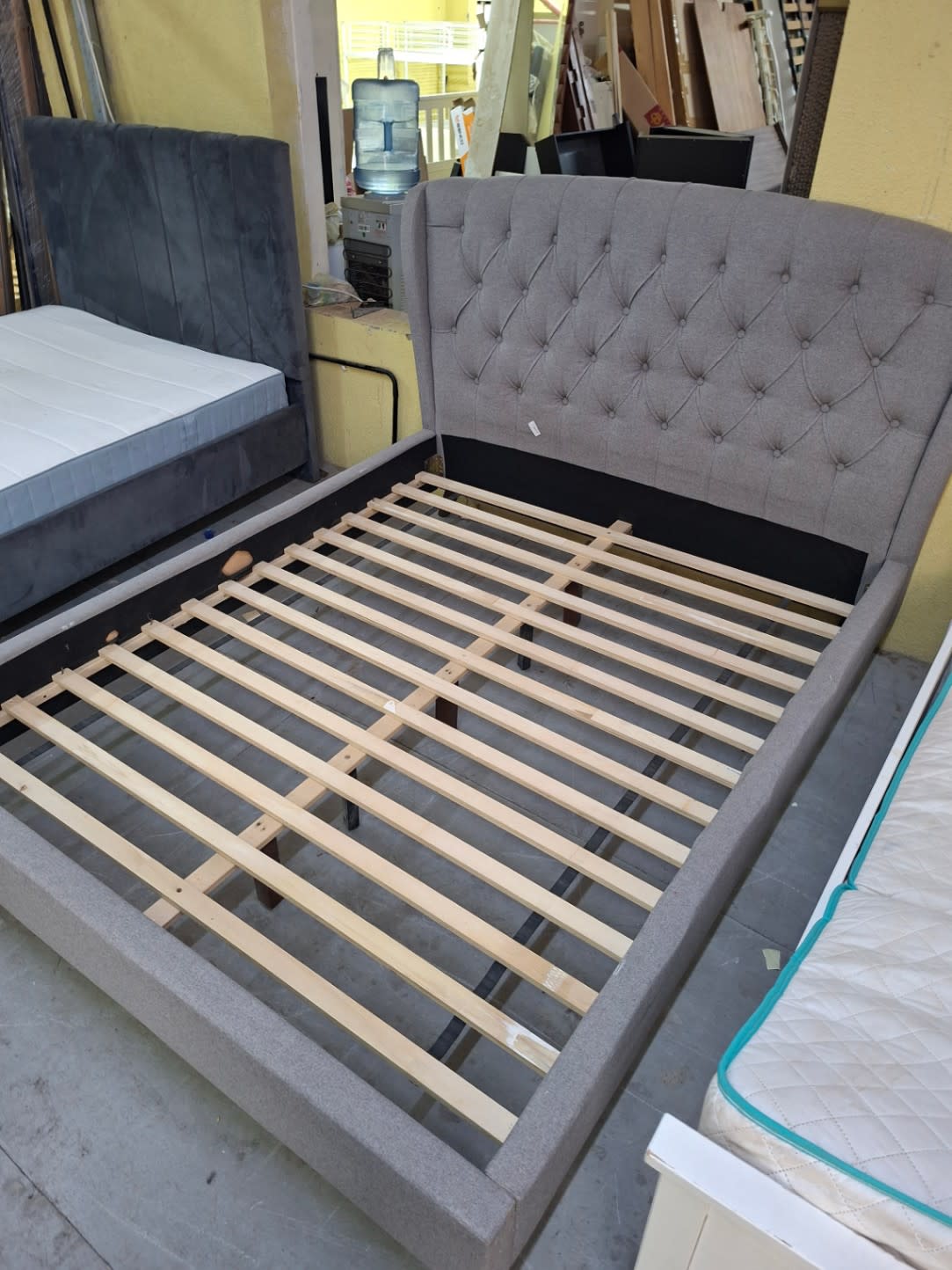 upholstered platform bed frame with a tufted headboard 3