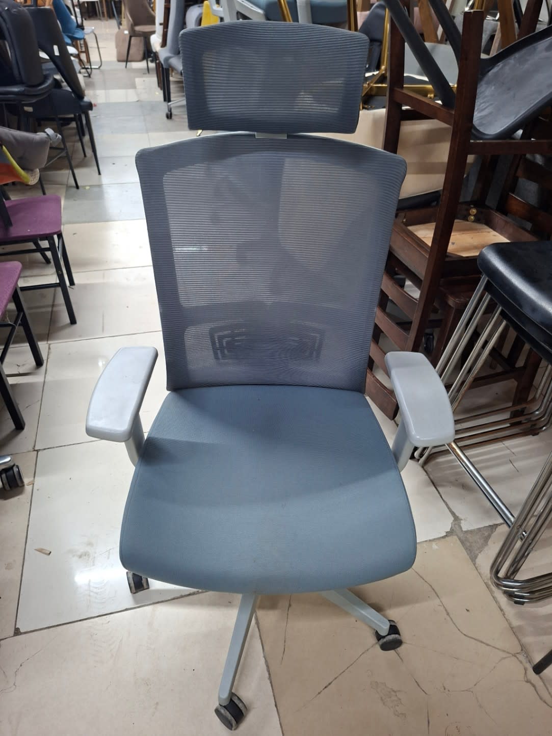 grey ergonomic office desk chair on wheels