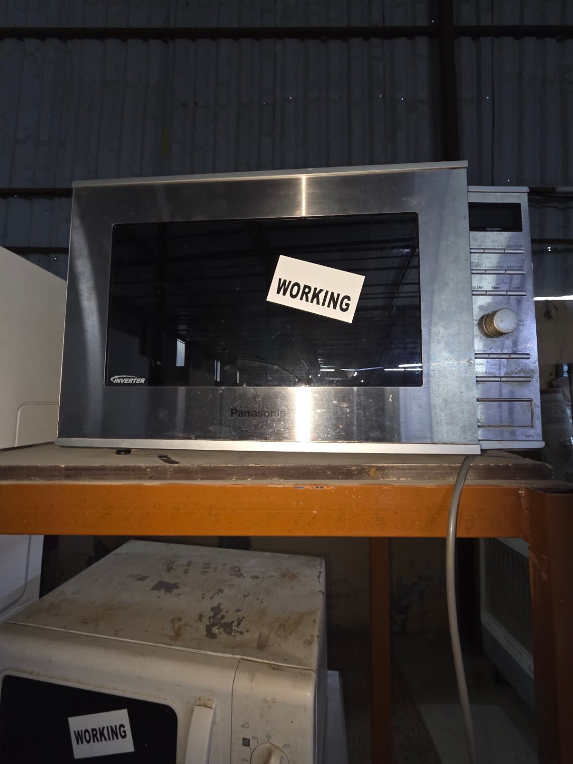Front view of used Panasonic Inverter Microwave Oven stainless steel good condition at Bufaisal Ajman