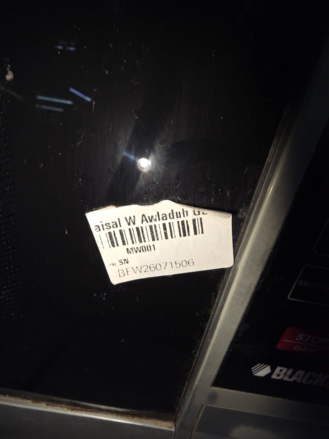 Bufaisal barcode label BFW26071506 for used Black & Decker microwave oven