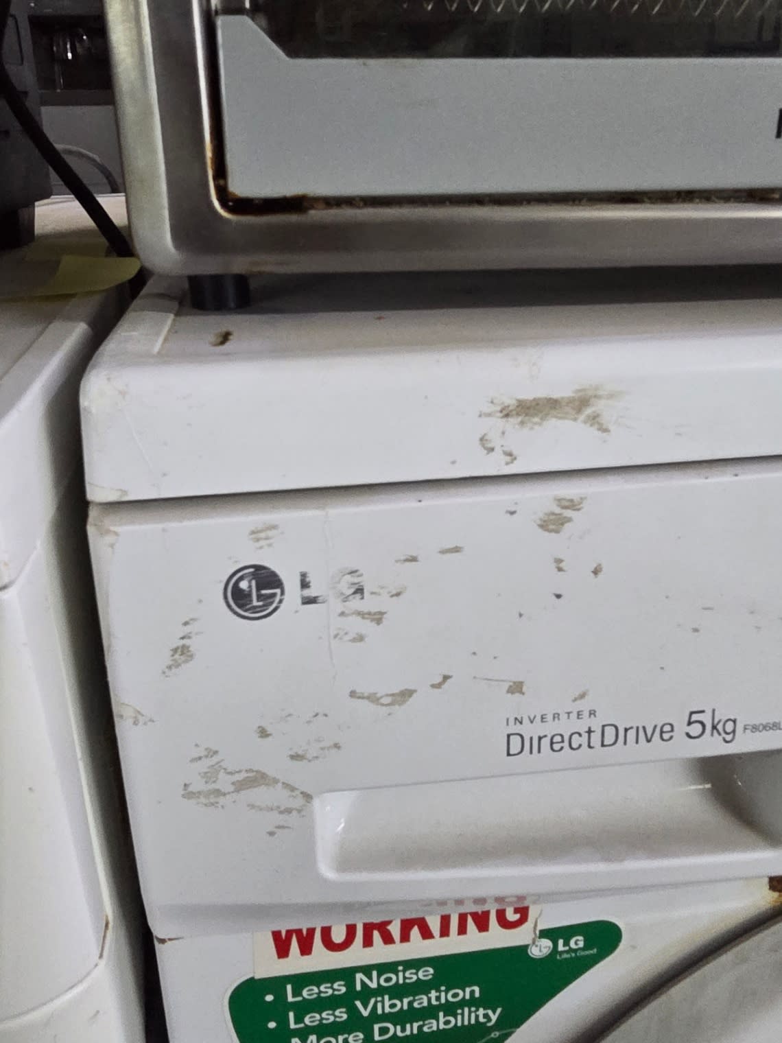 Bufaisal barcode label — barcode unreadable, used LG 5kg front-load washing machine Shop D Ajman