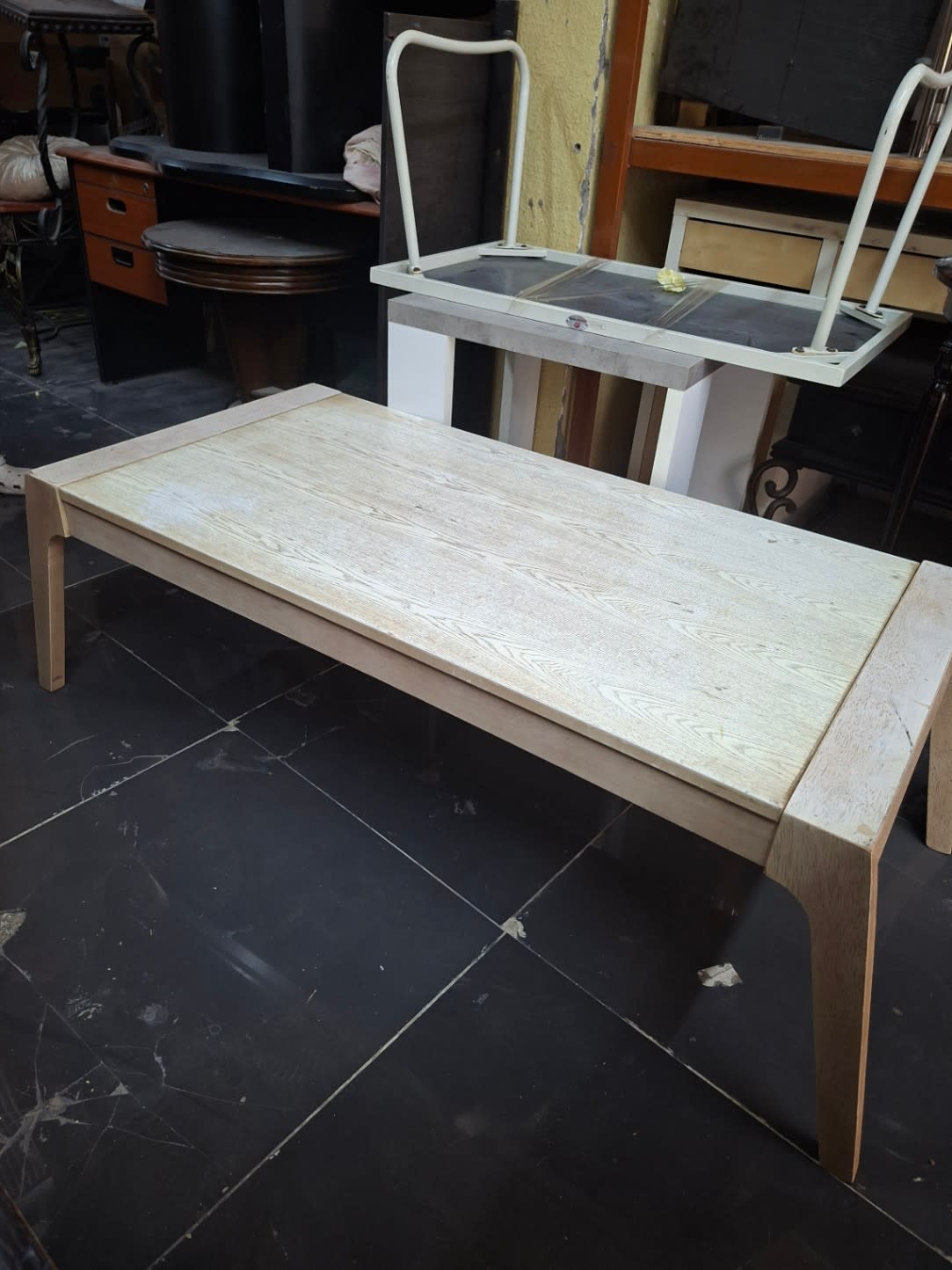 Front angle view of used rectangular coffee table light wood at Bufaisal Ajman