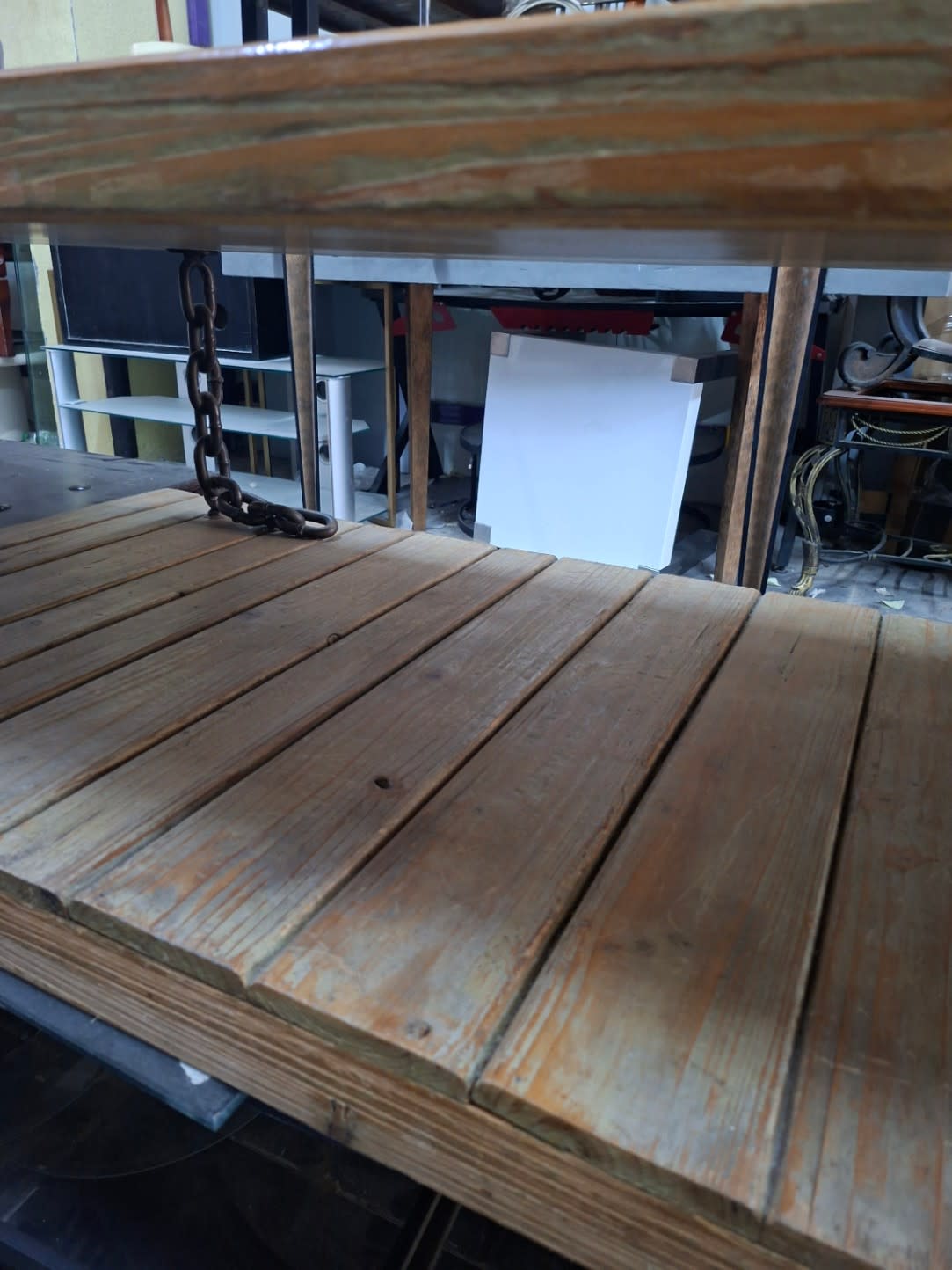 Top surface of used industrial coffee table showing wood grain wear and natural patina
