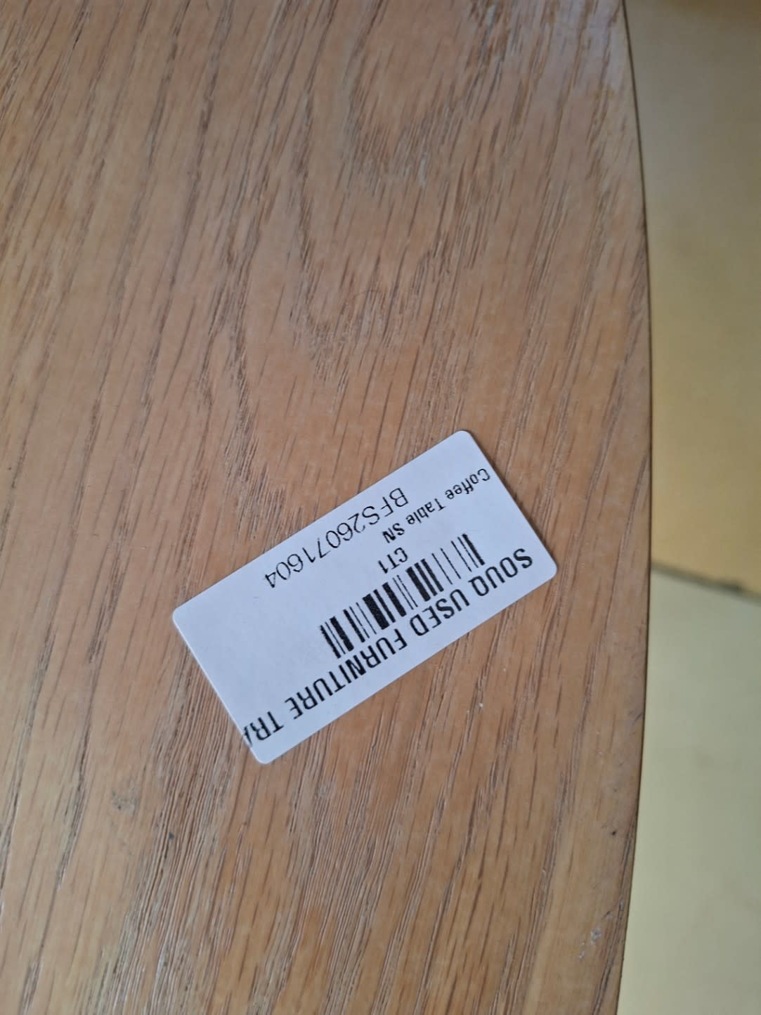 Bufaisal barcode label BFS26071604 for used oval coffee table at Shop C Ajman