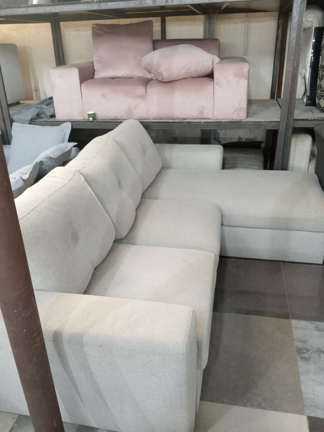 Full side view of used beige L-shape sectional sofa with chaise at Bufaisal Shop D Ajman
