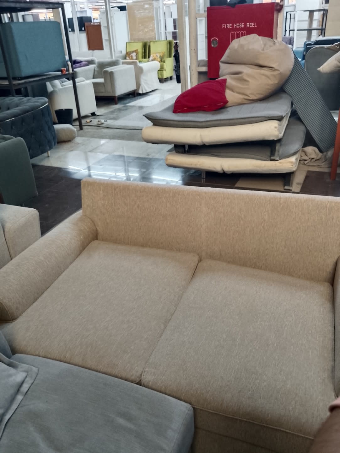 Bufaisal barcode label photo for used beige 3-seater sofa listing