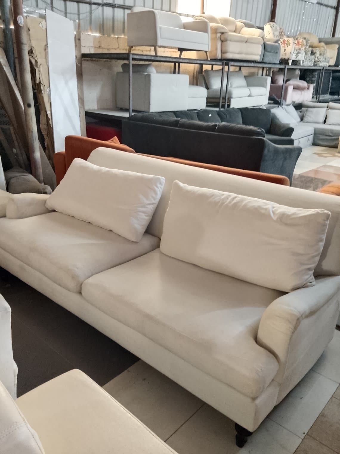 Bufaisal barcode label for used 3-seater cream fabric sofa — label unreadable