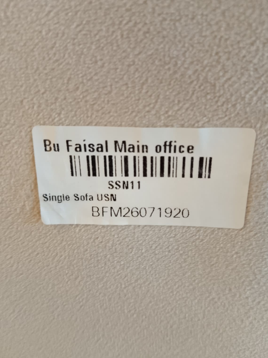 Bufaisal barcode label BFM26071920 for used 2-seater sofa at Shop D Ajman