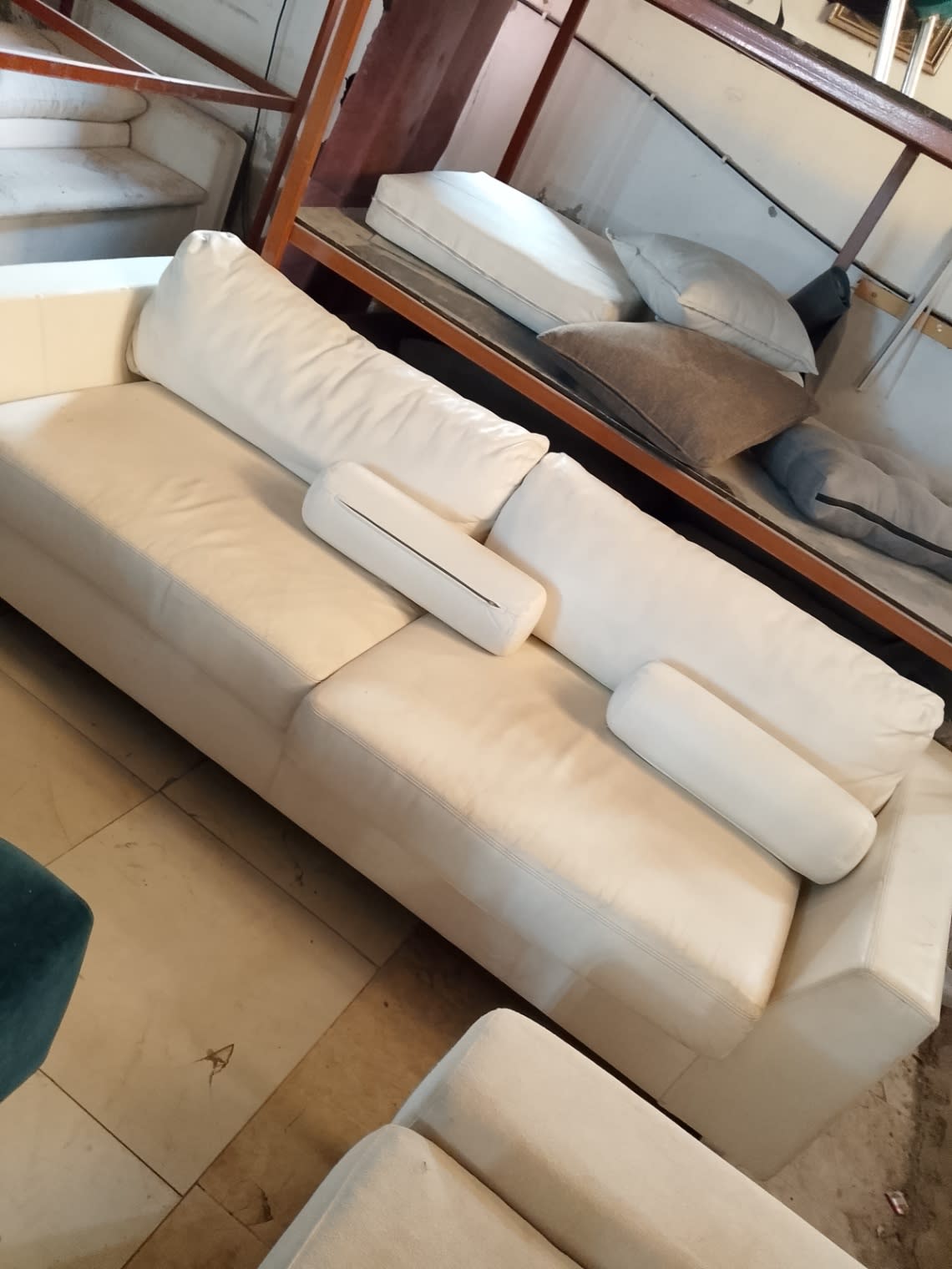 Bufaisal barcode label photo for used off-white 3-seater leather sofa — label unreadable
