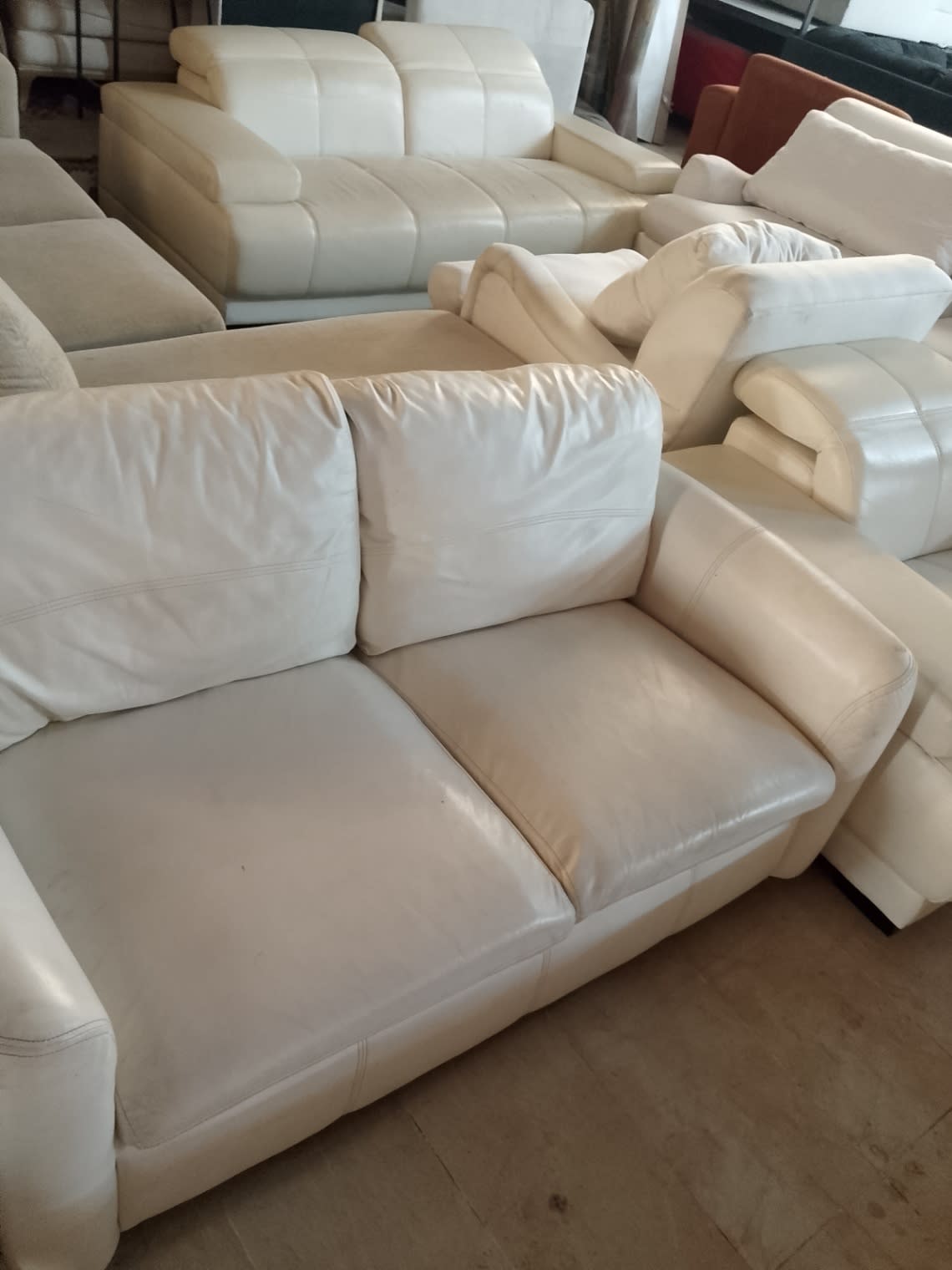 Bufaisal barcode label for used 2-seater cream leather sofa