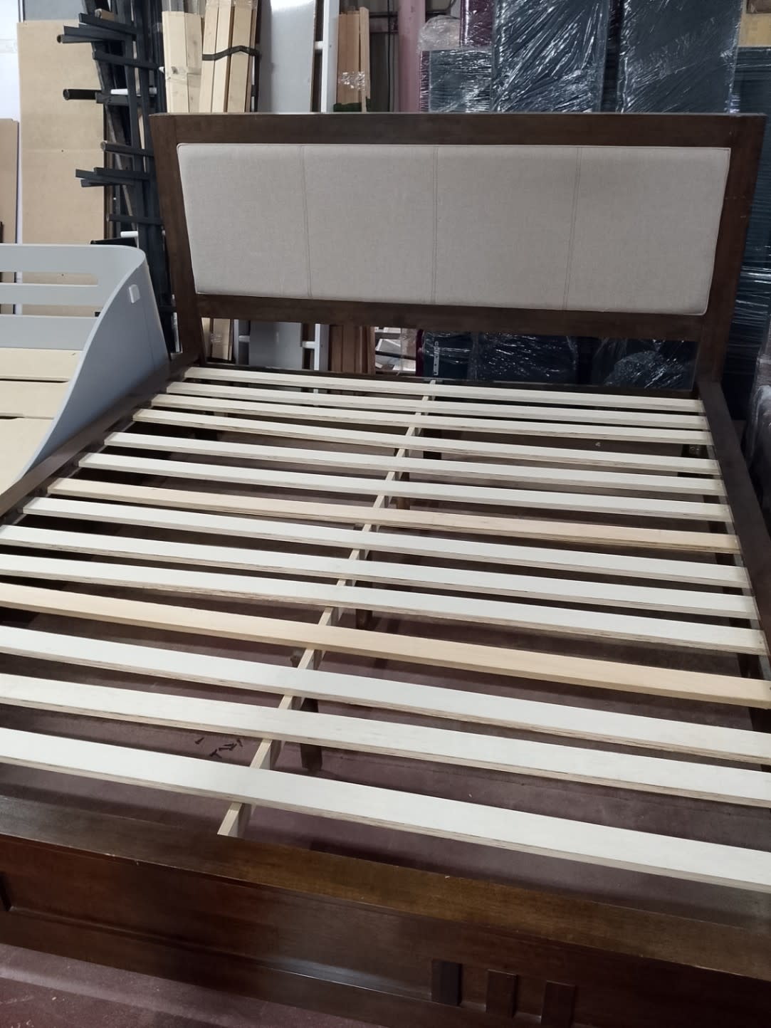 Fourth photo of used king bed frame with storage showing overall condition at Shop D Ajman
