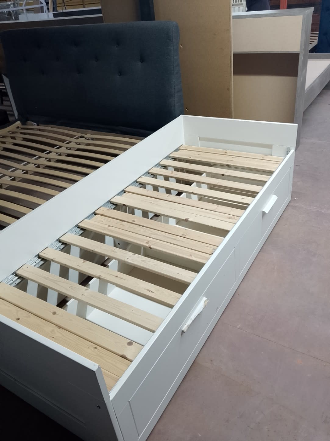Second side angle of used white single bed frame with storage drawers at Bufaisal Shop D Ajman