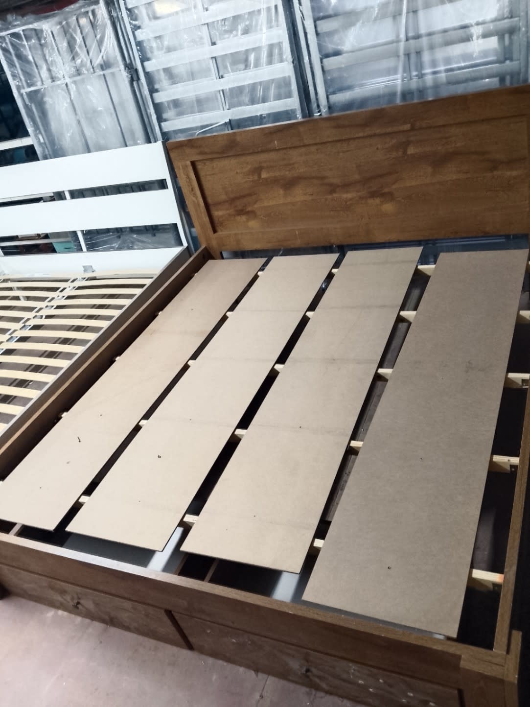 Barcode label photo for used king bed frame with storage drawers at Bufaisal Shop D Ajman